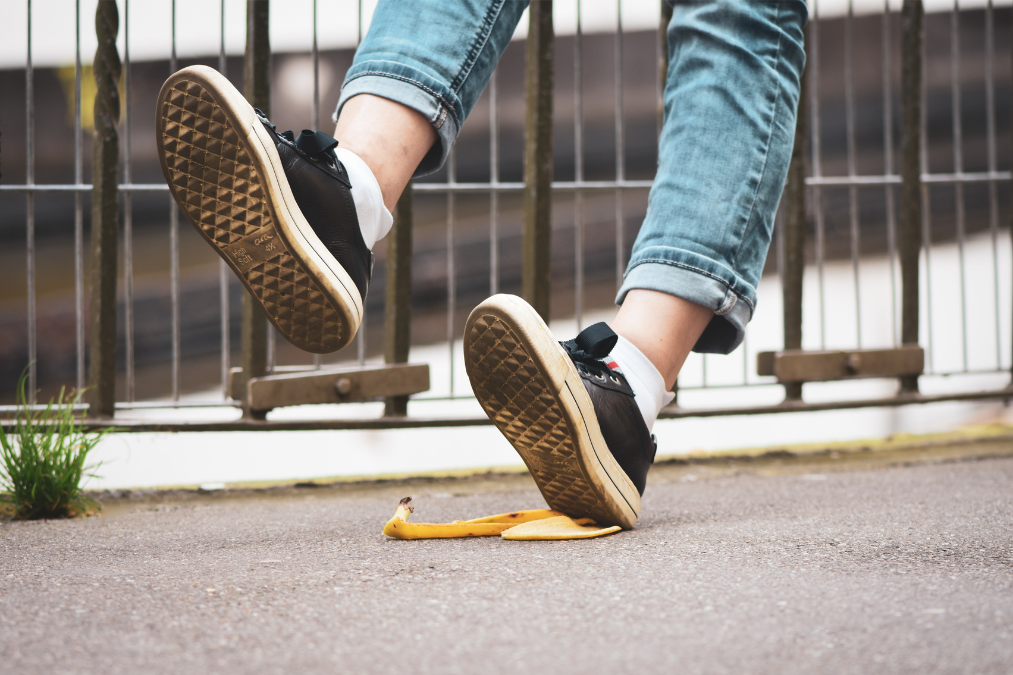 Person slipping on a banana peel.